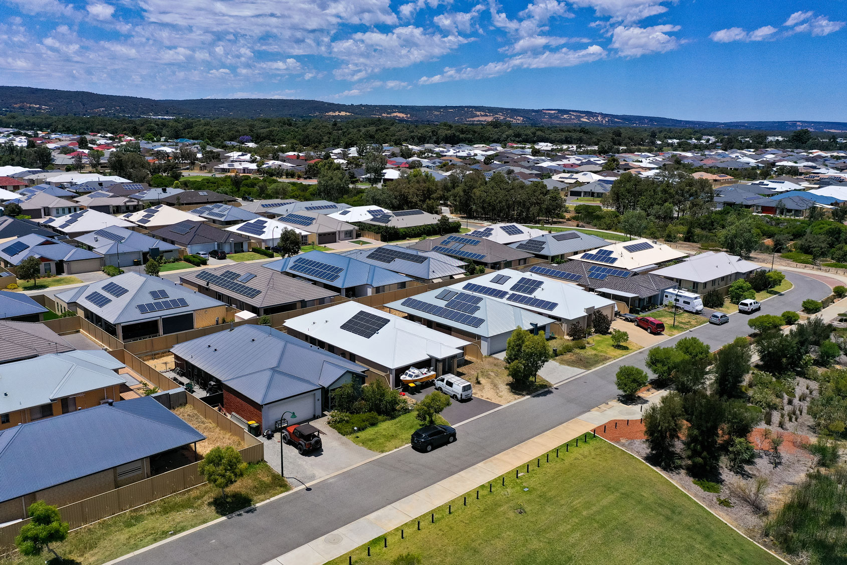 Aerial view of houses with rooftop solar installed