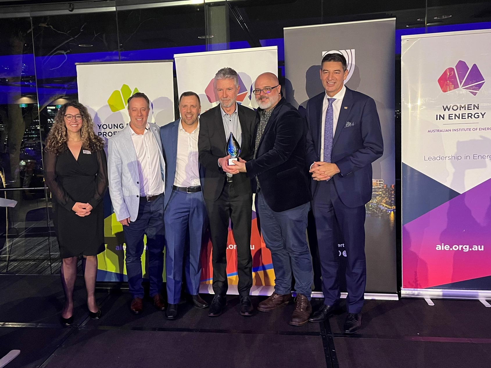 The Project Symphony team stood together holding the Energy Innovation of the Year award.