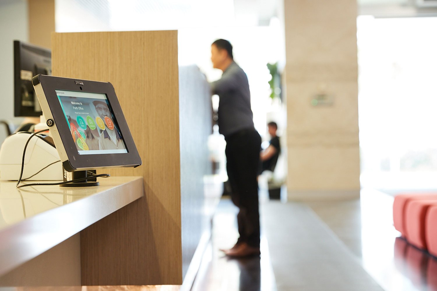 Western Power reception desk with a male stood at the counter
