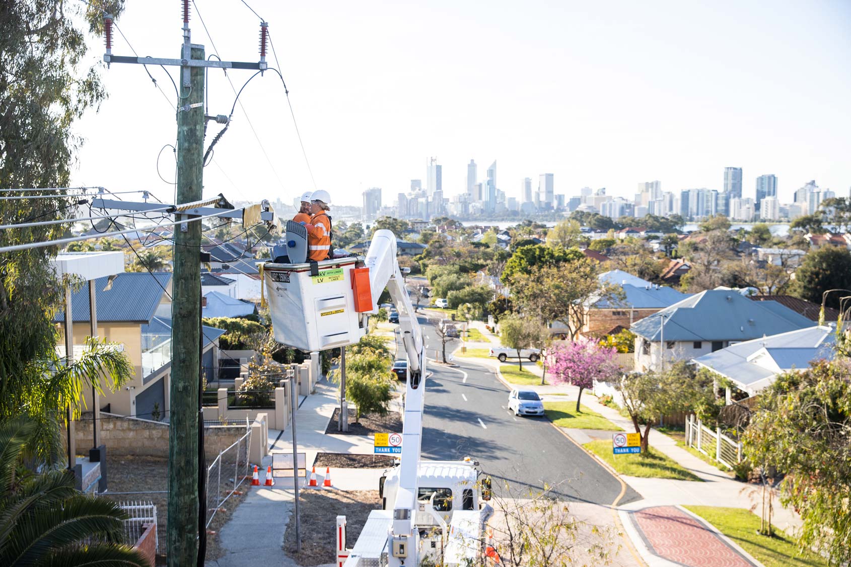 Western Power crew fixing electricity lines in a residential street