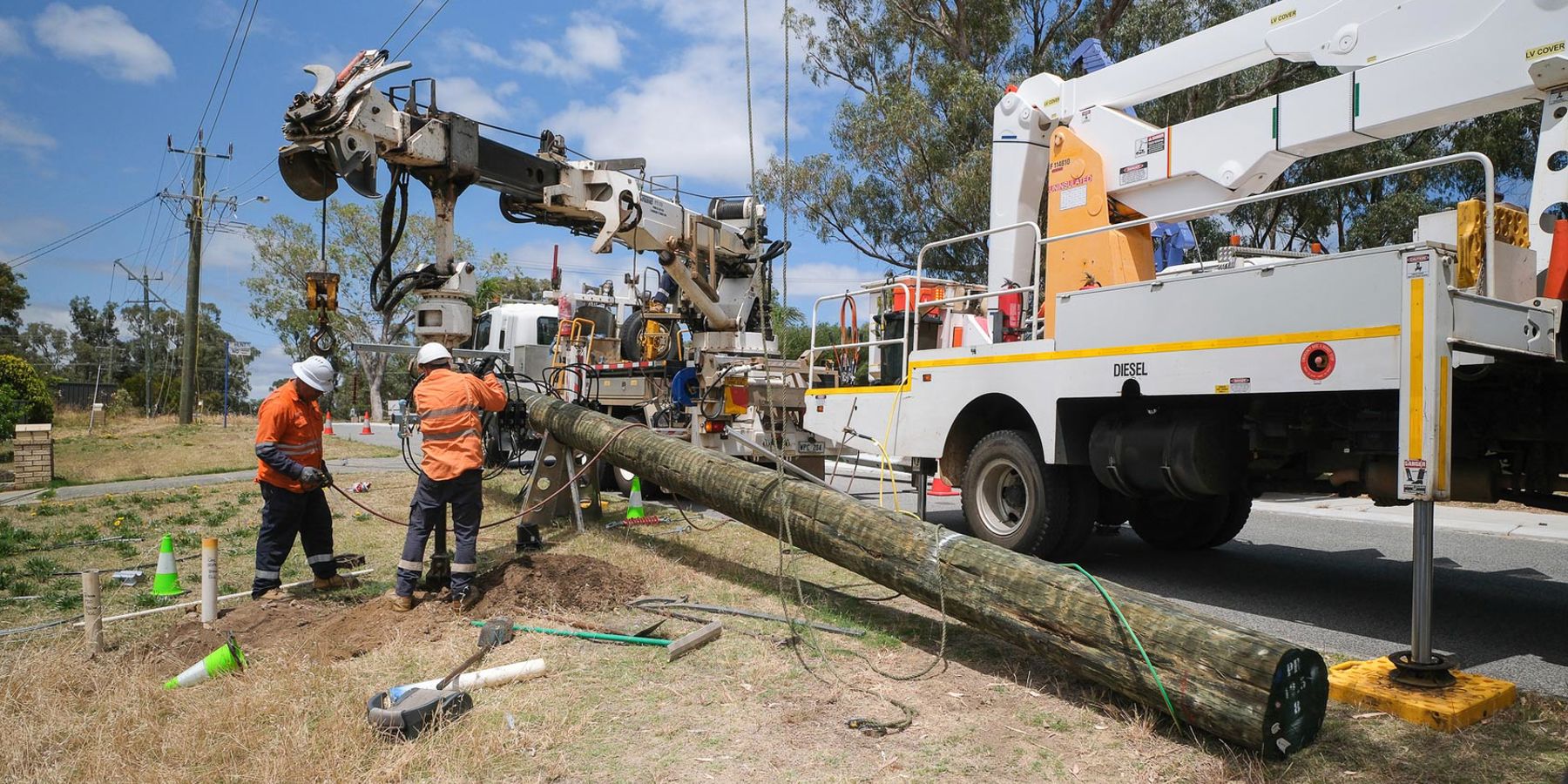 An electricity pole being replaced by a Western Power crew.
