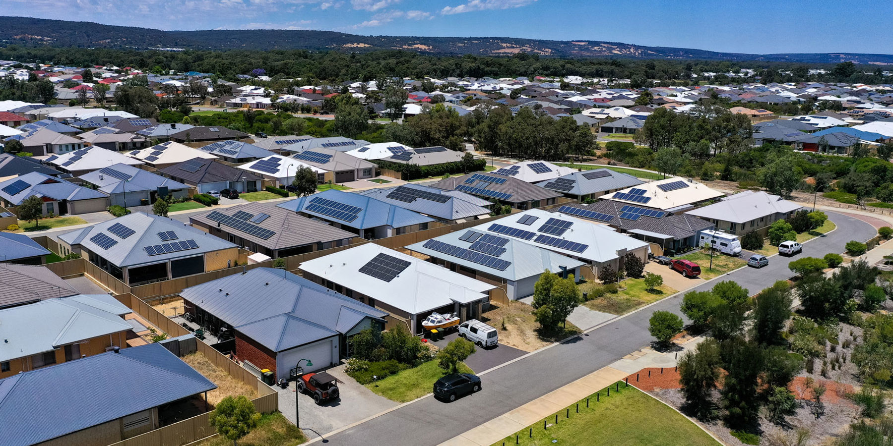 Aerial view of houses with rooftop solar installed